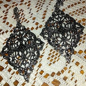 - Silver-tone pierced earrings